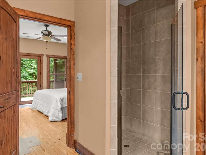 129 Nodatsi Court, Brevard, NC 28712.  MLS# CAR4407587, YatesRealty ID 41149. Custom tiled, walk-in  shower