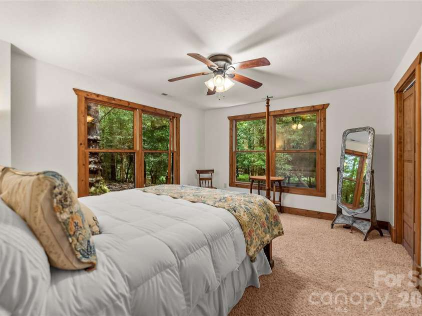 129 Nodatsi Court, Brevard, NC 28712.  MLS# CAR4407587, YatesRealty ID 41149. First lower level guest room with huge windows