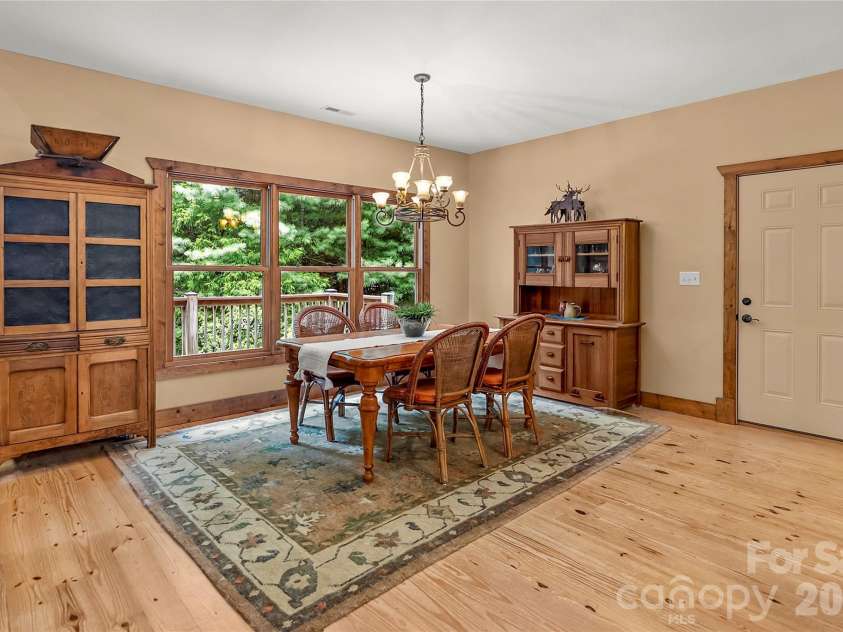 129 Nodatsi Court, Brevard, NC 28712.  MLS# CAR4407587, YatesRealty ID 41149. Spacious dining area with room for a crowd