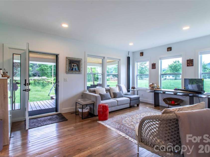 16 Riverside Drive, Barnardsville, NC 28709.  MLS# CAR4396909, YatesRealty ID 41152. Views from every window.