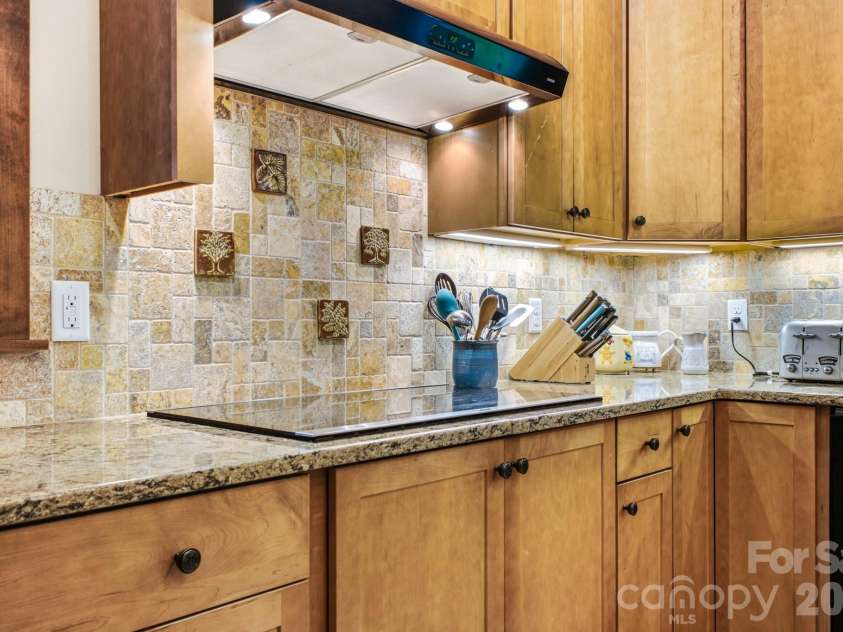 101 Reeds Creek Road, Fairview, NC 28730.  MLS# CAR4409331, YatesRealty ID 41158. Kitchen w/induction cooktop