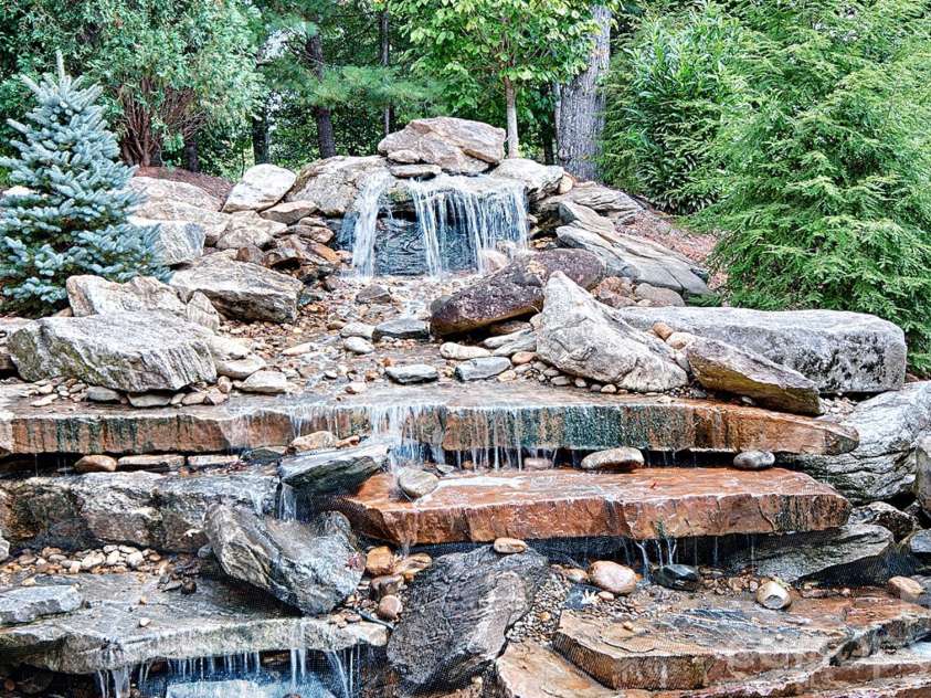 22 Bittersweet Lane, Asheville, NC 28805.  MLS# CAR4408538, YatesRealty ID 41169. WATERFALL