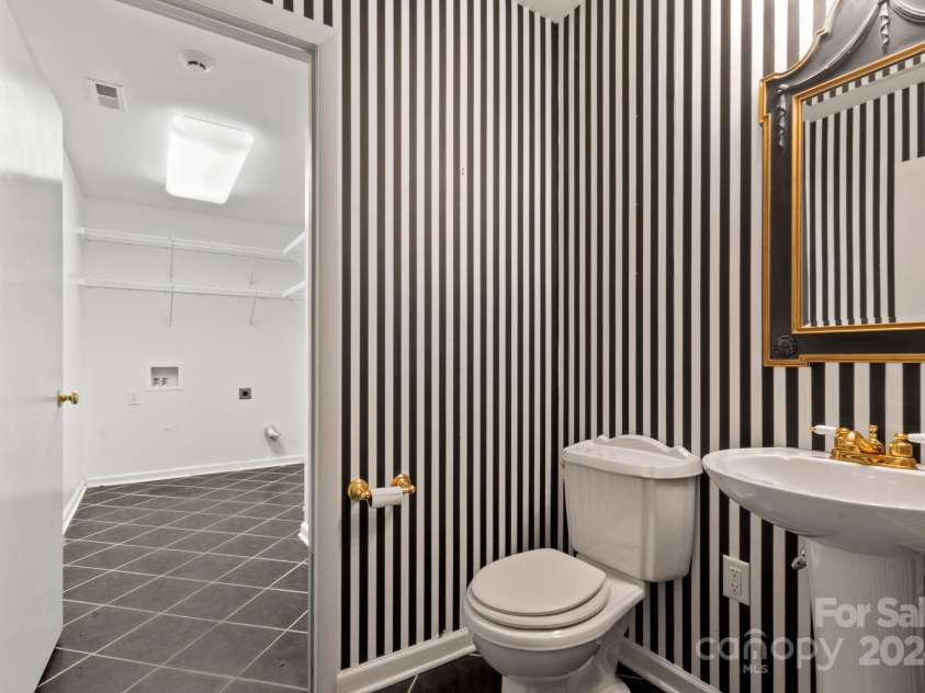 702 Forest Hill Drive, Shelby, NC 28150.  MLS# CAR4185280, YatesRealty ID 4119. Half bath and laundry room on the main floor