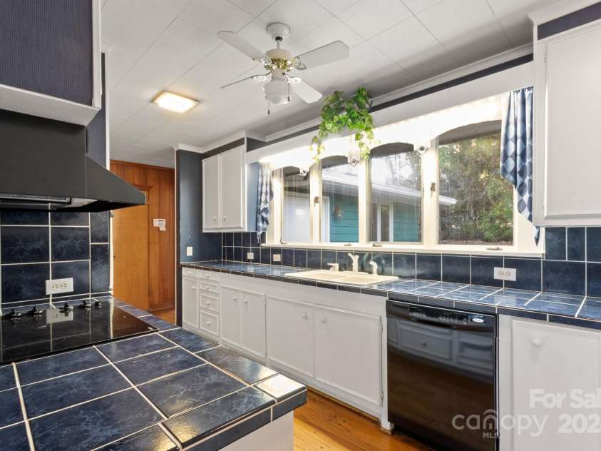 702 Forest Hill Drive, Shelby, NC 28150.  MLS# CAR4185280, YatesRealty ID 4119. Multiple large windows in the kitchen bring in extra light.