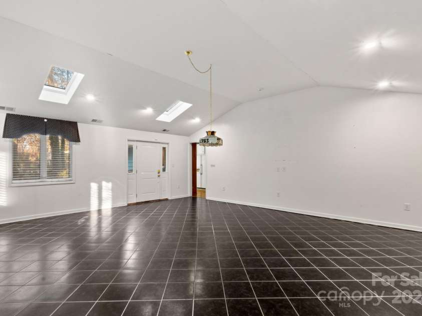702 Forest Hill Drive, Shelby, NC 28150.  MLS# CAR4185280, YatesRealty ID 4119. There are endless possible uses for this recreation room with vaulted ceiling!