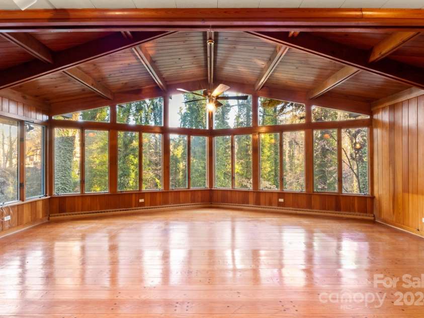 702 Forest Hill Drive, Shelby, NC 28150.  MLS# CAR4185280, YatesRealty ID 4119. Volume ceilings with full height windows in this spectacular main family room overlook the creek below.