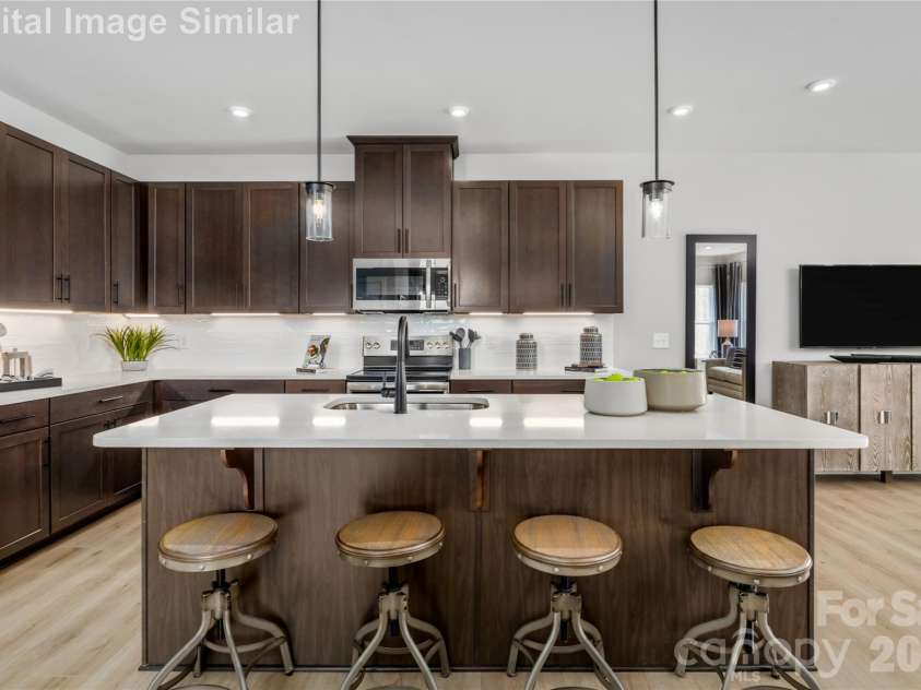 9617 Teamwork Street, Concord, NC 28027.  MLS# CAR4409795, YatesRealty ID 41190. Step Into A Space Where Culinary Creativity Meets Effortless Hosting.  This Kitchen Wasn't Just Built For Cooking - It Was Designed To Be The Heart Of the Party.