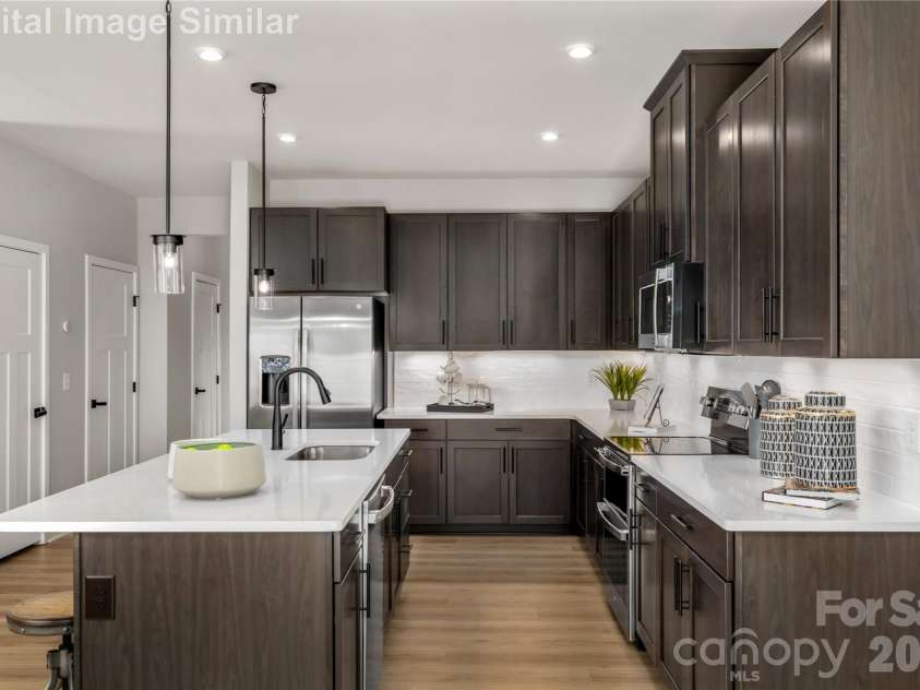 9617 Teamwork Street, Concord, NC 28027.  MLS# CAR4409795, YatesRealty ID 41190. This Layout Isn't Just Open  It's Expansive, Airy, And Intuitive, Designed To Make MultiTasking Feel Like Second Nature. So Go Ahead, Stir the Sauce, Laugh At The Jokes, And Never Miss A Beat.