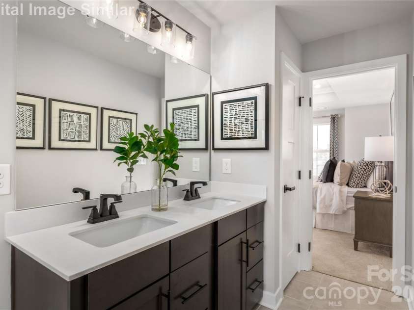 9617 Teamwork Street, Concord, NC 28027.  MLS# CAR4409795, YatesRealty ID 41190. Tucked Away Within The Primary Suite, This Ensuite Bathroom Is Designed With Intention, It Effortlessly Combines Style, Function and Indulgence.