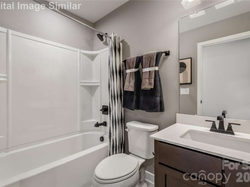 9615 Teamwork Street, Concord, NC 28027.  MLS# CAR4409797, YatesRealty ID 41191. Conveniently Located Near The Two Guest Bedrooms, It Allows Seamless Access While Maintaining Privacy - Perfect For Sharing Without Compromising Anyone's Personal Space.