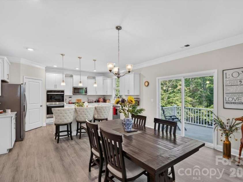 166 Aviendha Lane, Troutman, NC 28166.  MLS# CAR4409150, YatesRealty ID 41198. Breakfast area looking back into the open Kitchen