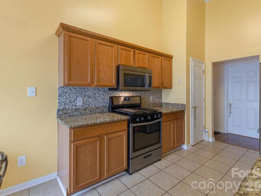 9704 Aventide Lane, Charlotte, NC 28215.  MLS# CAR4403212, YatesRealty ID 41214. Kitchen View A