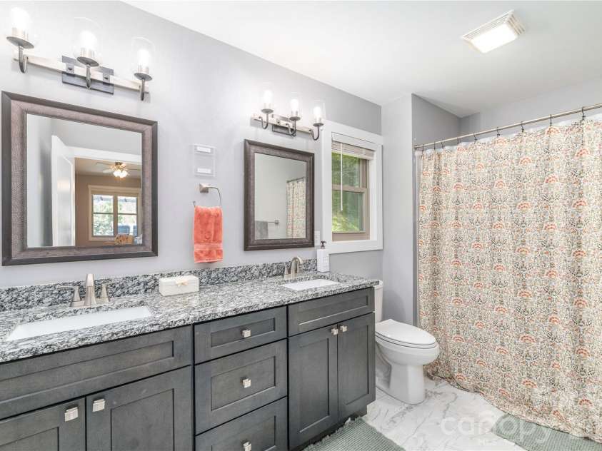 68 Clear View Drive, Mars Hill, NC 28754.  MLS# CAR4410650, YatesRealty ID 41241. Ensuite bath with granite dbl vanity
