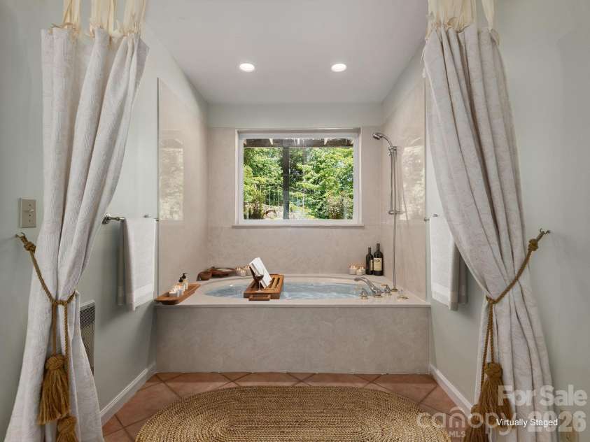 1572 Brushy Fork Road, Sylva, NC 28779.  MLS# CAR4404405, YatesRealty ID 41243. Virtually Staged .Relax and unwind in the private jacuzzi tub retreat