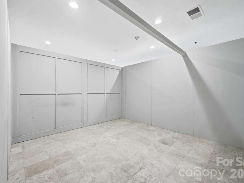 21 Battery Park Avenue, Asheville, NC 28801.  MLS# CAR4366856, YatesRealty ID 4126. Bedroom Separated by Partition for Privacy without Staging