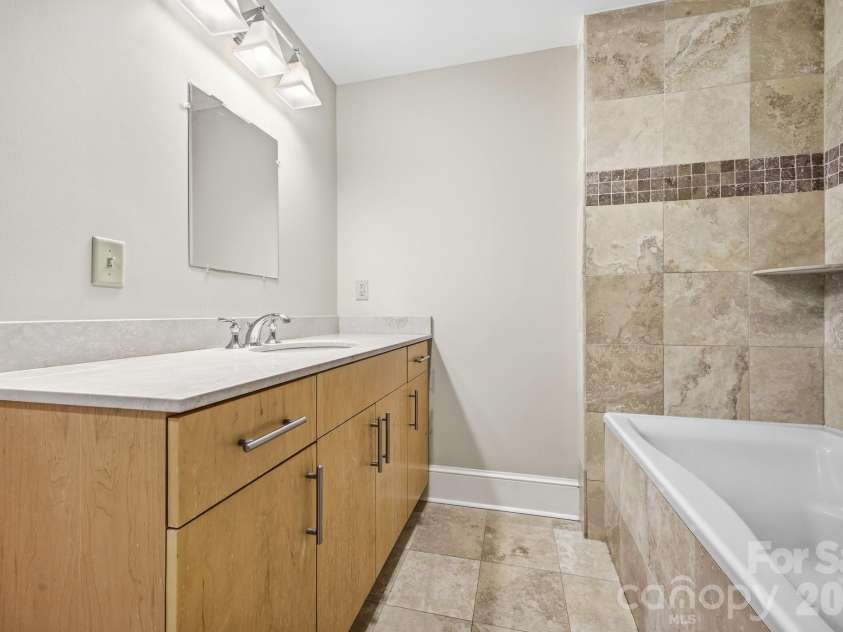 21 Battery Park Avenue, Asheville, NC 28801.  MLS# CAR4366856, YatesRealty ID 4126. Large Vanity with Lots of Storage in Vanity