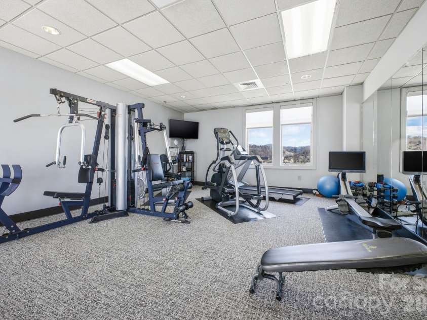 21 Battery Park Avenue, Asheville, NC 28801.  MLS# CAR4366856, YatesRealty ID 4126. Penthouse Fitness Center