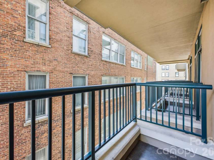 21 Battery Park Avenue, Asheville, NC 28801.  MLS# CAR4366856, YatesRealty ID 4126. Twin Balconies off Living Area