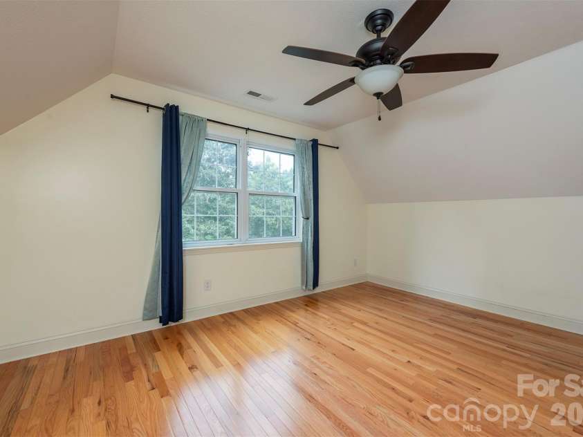90 Pine Forest Drive, Weaverville, NC 28787.  MLS# CAR4407692, YatesRealty ID 41271. A second floor bedroom with ample room to spread out