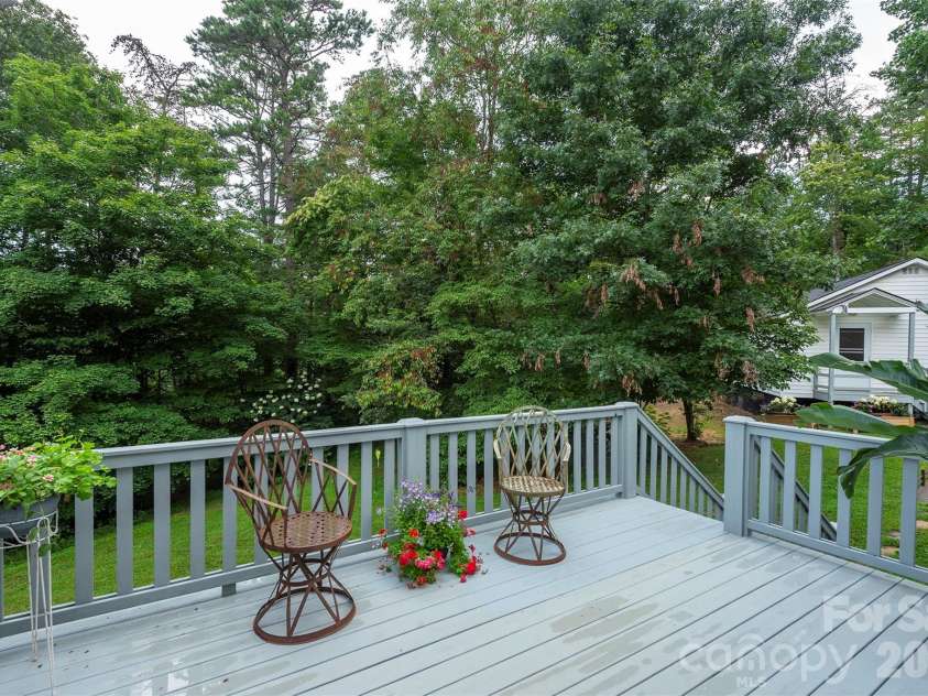 90 Pine Forest Drive, Weaverville, NC 28787.  MLS# CAR4407692, YatesRealty ID 41271. An upper deck overlooking wooded acres in the backyard