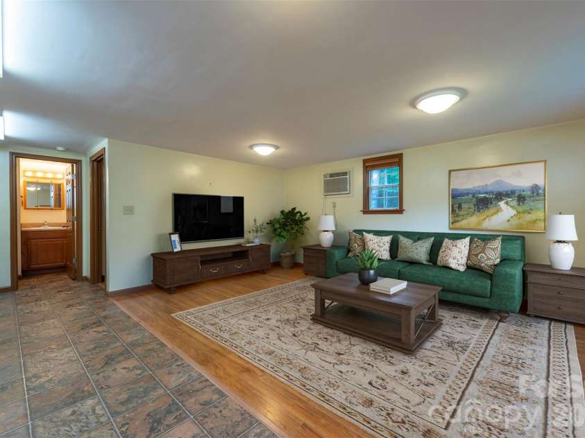 90 Pine Forest Drive, Weaverville, NC 28787.  MLS# CAR4407692, YatesRealty ID 41271. The cottage living/dining area. Virtually staged