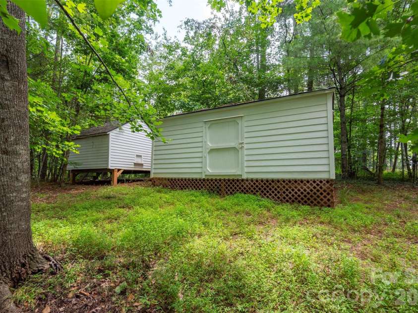 90 Pine Forest Drive, Weaverville, NC 28787.  MLS# CAR4407692, YatesRealty ID 41271. Two like-new storage sheds