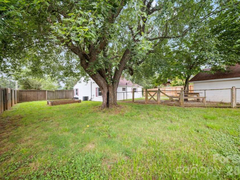 236 Governors View Road, Asheville, NC 28805.  MLS# CAR4409407, YatesRealty ID 41275. Expansive fully fenced side yard