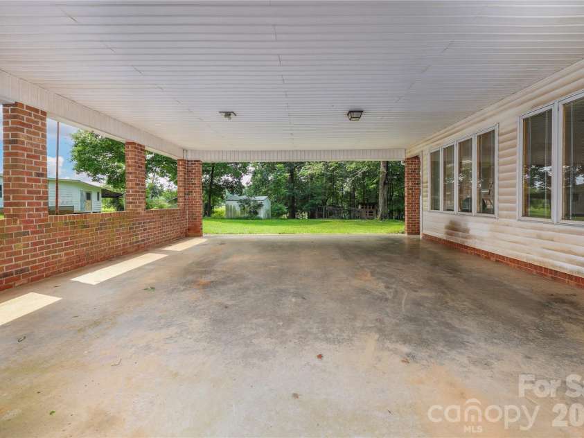 4988 Amick Lane, Liberty, NC 27298.  MLS# CAR4408844, YatesRealty ID 41277. 4988 Amick carport