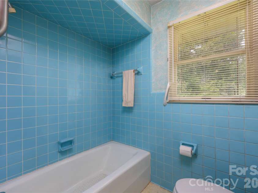 4988 Amick Lane, Liberty, NC 27298.  MLS# CAR4408844, YatesRealty ID 41277. Hall bath