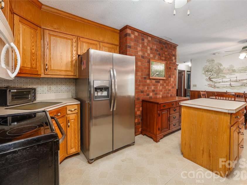4988 Amick Lane, Liberty, NC 27298.  MLS# CAR4408844, YatesRealty ID 41277. Kitchen