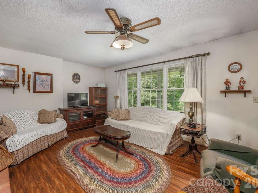 4988 Amick Lane, Liberty, NC 27298.  MLS# CAR4408844, YatesRealty ID 41277. Living room
