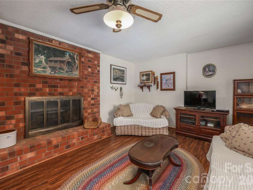 4988 Amick Lane, Liberty, NC 27298.  MLS# CAR4408844, YatesRealty ID 41277. Living room
