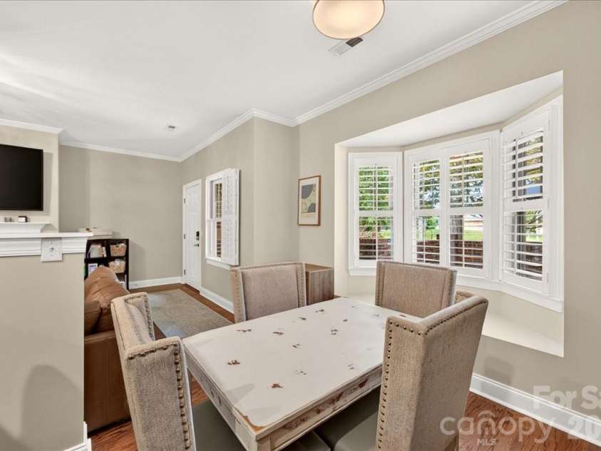 4632 Dabney Vigor Drive, Charlotte, NC 28209.  MLS# CAR4405775, YatesRealty ID 41279. Dining area with a bay window overlooking the patio