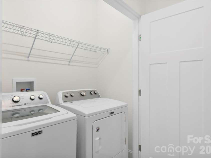 201 Mapleton Drive, East Flat Rock, NC 28726.  MLS# CAR4404187, YatesRealty ID 41286. Convenient laundry room with washer and dryer included, making move-in easy.