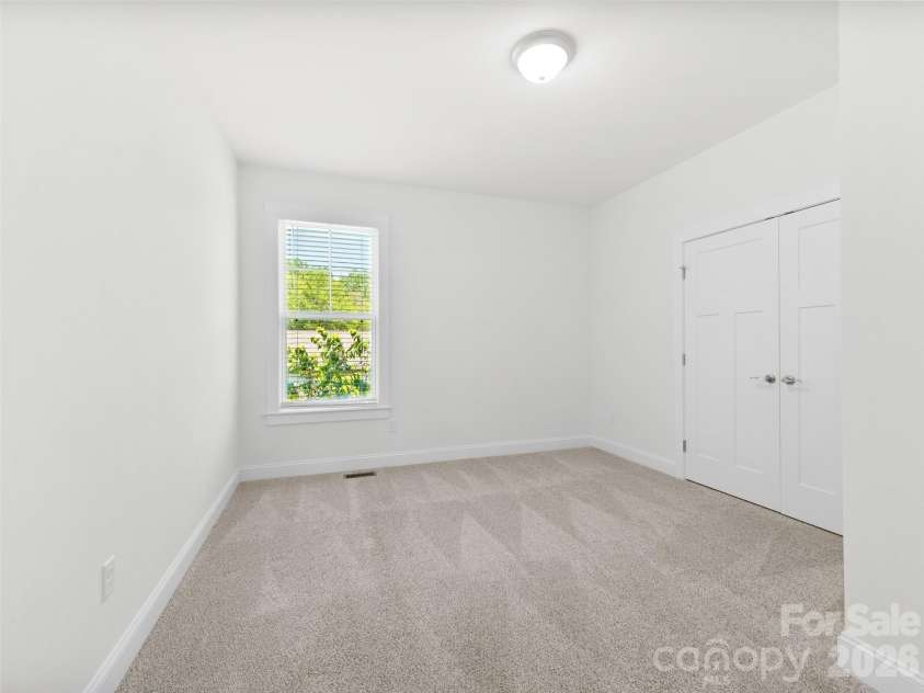 201 Mapleton Drive, East Flat Rock, NC 28726.  MLS# CAR4404187, YatesRealty ID 41286. Versatile third bedroom ideal for guests, a home office, or hobby room.