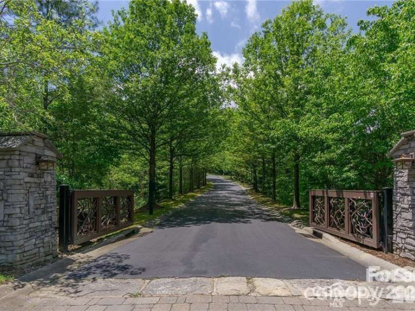 9999 Woodhen Way, Horse Shoe, NC 28742.  MLS# CAR4342932, YatesRealty ID 4129. Main gate entry