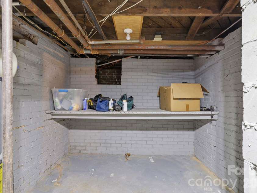 46 Marsh Avenue, Concord, NC 28025.  MLS# CAR4409053, YatesRealty ID 41296. Basement storage
