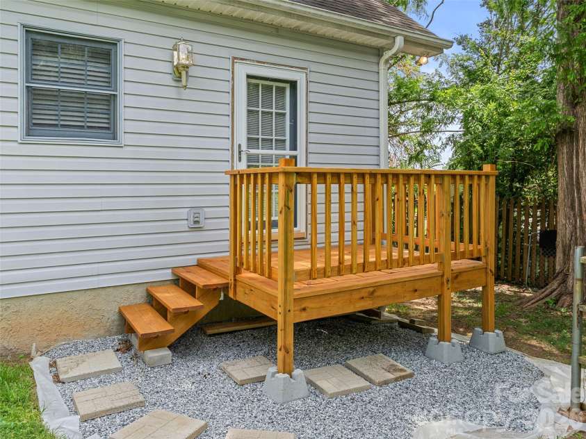 66 Hyde Avenue, Tryon, NC 28782.  MLS# CAR4403009, YatesRealty ID 41303. Rear Deck - New July 2026