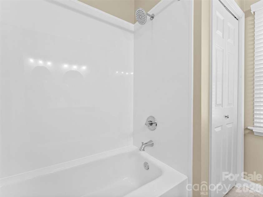 66 Hyde Avenue, Tryon, NC 28782.  MLS# CAR4403009, YatesRealty ID 41303. Shower/tub in Primary Bathroom