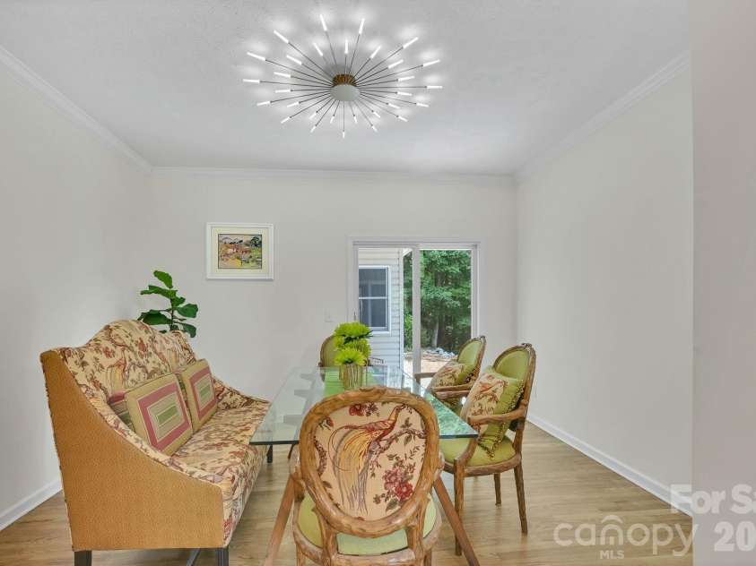 77 Carriage West Drive, Hendersonville, NC 28791.  MLS# CAR4403806, YatesRealty ID 41315. Dining Area Facing Backyard