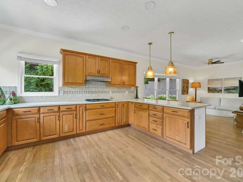 77 Carriage West Drive, Hendersonville, NC 28791.  MLS# CAR4403806, YatesRealty ID 41315. Kitchen Facing Den