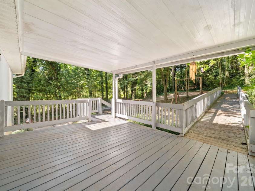 33 Baker Drive, Asheville, NC 28806.  MLS# CAR4406156, YatesRealty ID 41316. Covered back porch