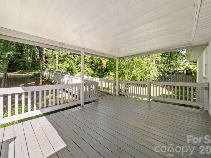 33 Baker Drive, Asheville, NC 28806.  MLS# CAR4406156, YatesRealty ID 41316. Covered back porch