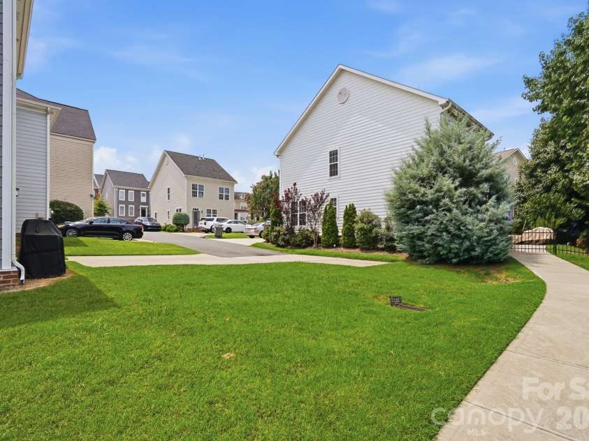 9406 Kings Parade Boulevard, Charlotte, NC 28273.  MLS# CAR4410774, YatesRealty ID 41349. Additional angle highlighting the spacious side yard.