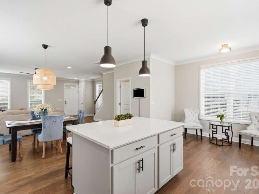 9406 Kings Parade Boulevard, Charlotte, NC 28273.  MLS# CAR4410774, YatesRealty ID 41349. Another view showcasing the spacious island and open layout.