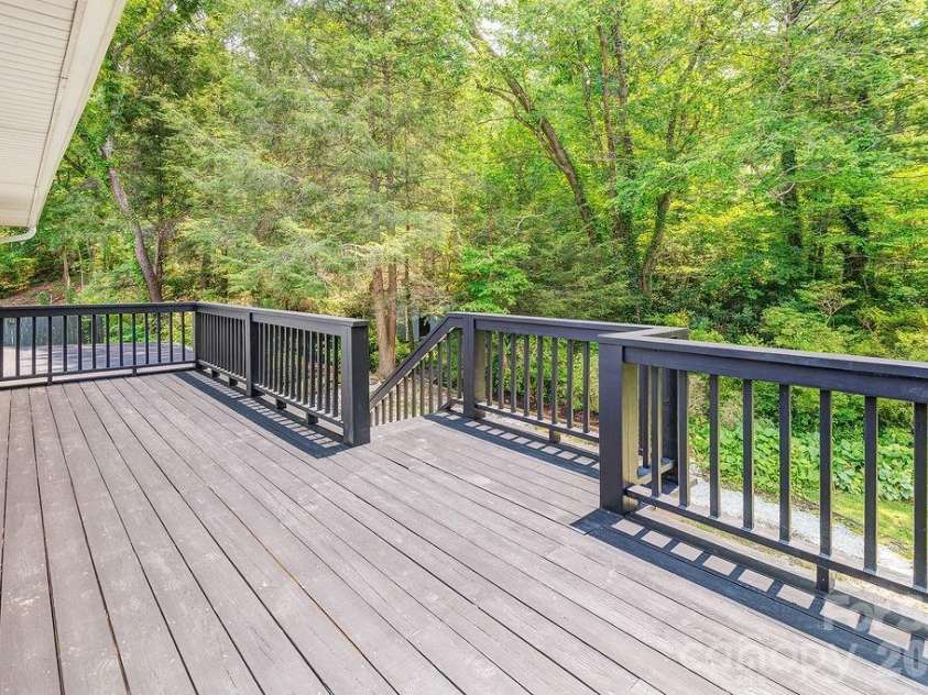 47 Bell Road, Asheville, NC 28805.  MLS# CAR4402411, YatesRealty ID 41364. Freshly painted back deck in a park like setting.