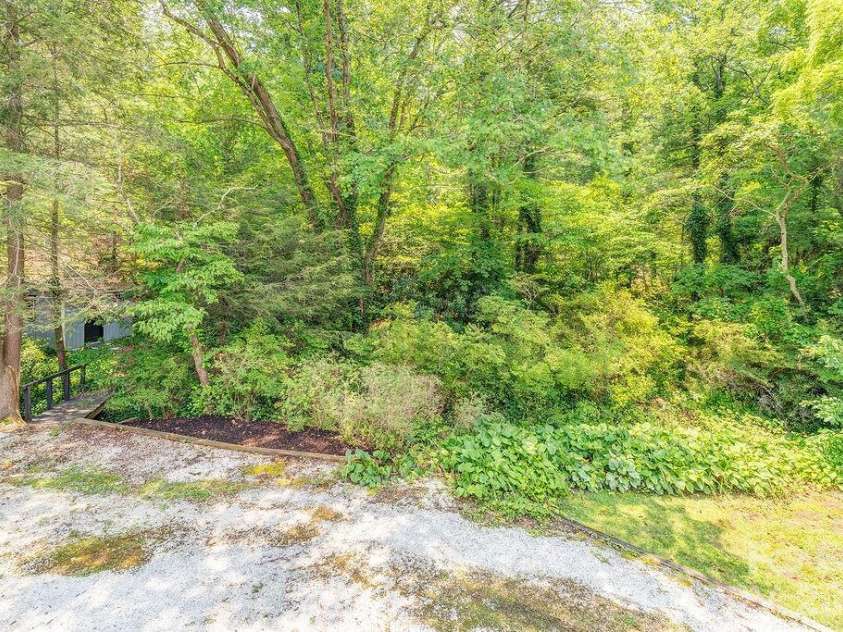 47 Bell Road, Asheville, NC 28805.  MLS# CAR4402411, YatesRealty ID 41364. So many azaleas! Just wait until you see it Spring!!
