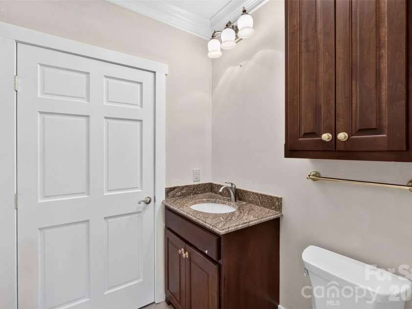370 Mountain Side Drive, Columbus, NC 28722.  MLS# CAR4406974, YatesRealty ID 41377. 1/2 Bath in basement before utility room