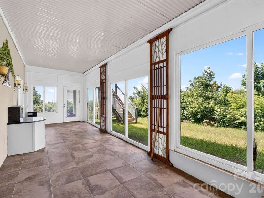 370 Mountain Side Drive, Columbus, NC 28722.  MLS# CAR4406974, YatesRealty ID 41377. Sunroom area off basemen