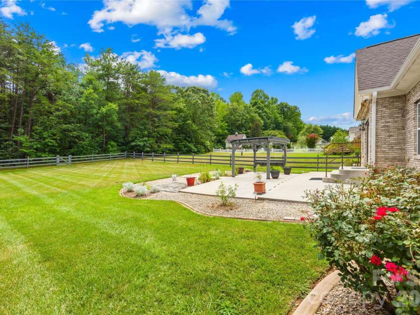 144 Quail Haven Drive, Troutman, NC 28166.  MLS# CAR4401635, YatesRealty ID 41381. Backs to wooded area